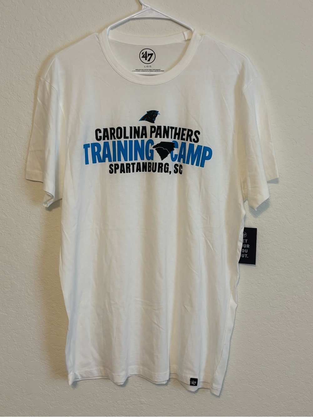 47 White Carolina Panthers Training Camp Tee with Blue and Black Graphics
